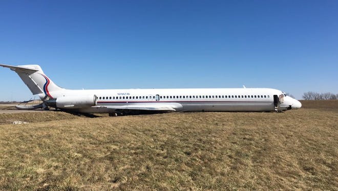 The plane, an Ameristar Air Cargo MD-83, aborted takeoff and eventually lurched to a halt on its belly.