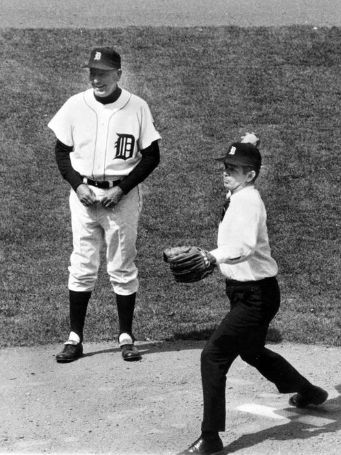 Governor William Milliken throwing the first pitch at the 1969 Tigers Opening Day game at Tiger Stadium.