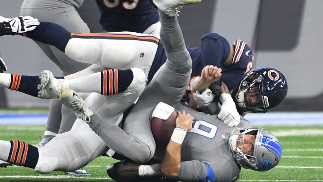 Lions quarterback Matthew Stafford is sacked by Bears' Roy Robertson-Harris in the first quarter.