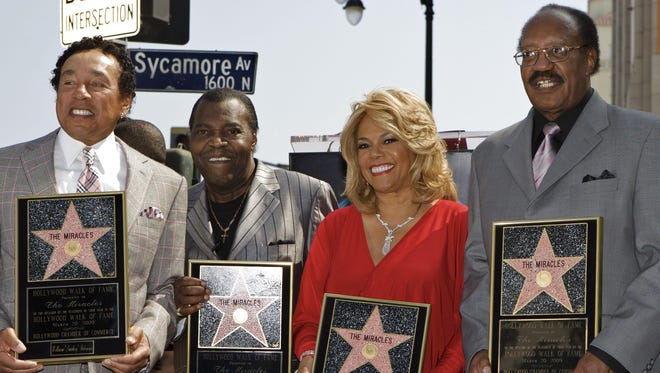 Warren “Pete” Moore, second from left,  Moore died Sunday. He, along with William “Smokey” Robinson, far left, Claudette Robinson and Robert “Bobby” Rogers of the famed Motown group The Miracles received a star on the Hollywood Walk of Fame in Los Angeles on March 20, 2009.
