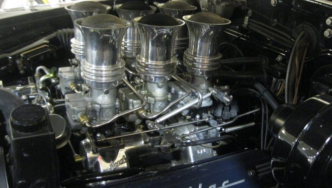 Larry Smith added six Stromberg carburetors, dual exhausts and disc brakes to his 1949 Cadillac fastback.