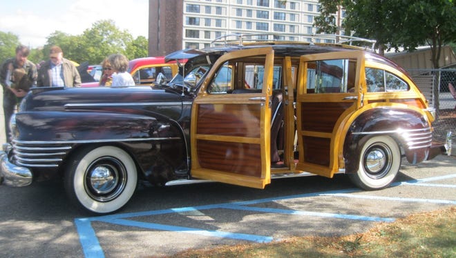 Al and Carole Scholten of Holland own this 1942 Chrysler Town & Country outfitted with every conceivable option for comfort and versatility. Admired for its rounded, barrel-back styling, it was one of the last civilian cars Chrysler built as the industry switched to wartime production.