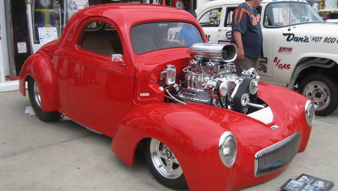 This red-hot 1941 Willys Pro Street hotrod, with body and chassis by Outlaw Performance of Avonmore, Pa., a 509-inch Chevrolet big-block engine and nine-inch Ford rear end, was among the conversions at the annual Gasoline Alley show and swap meet in Utica on Aug. 13, 2016.