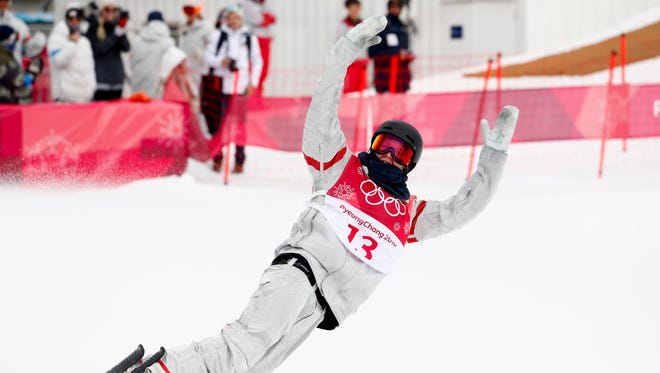 Kyle Mack, of the United States, reacts after his jump during the men's Big Air snowboard competition.