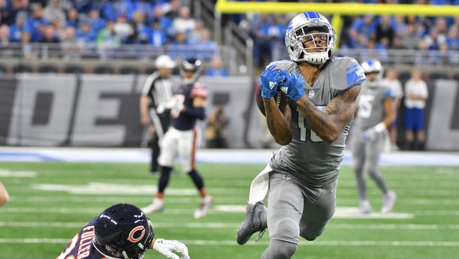 Lions' Kenny Golladay pulls in an over-the-shoulder reception along the sidelines but is called for an interference call, knocking down Bears' Kyle Fuller before the reception in the second quarter.