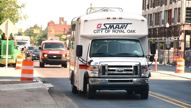 A SMART bus travels along Main Street near 11 Mile in Royal Oak on Friday.