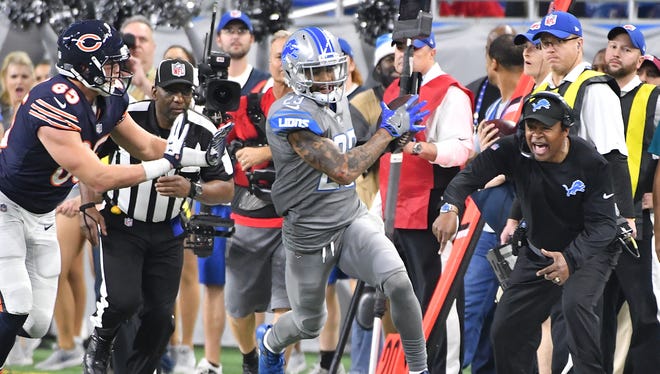 With the Bears in their red zone late in the fourth quarter, the Lions' Darius Slay intercepts a pass intended for the Bears' Daniel Brown, much to the pleasure of Detroit coach Jim Caldwell, turning the ball over to Detroit, which ran out the clock and preserved 20-10 victory.