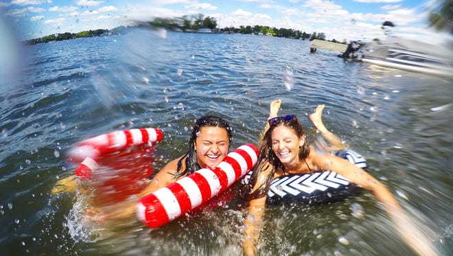 Second place: “Where the Living Is Easy,” by Marisa Aiello of Rochester Hills. Tubers have a splash fest on Lake Orion over the Fourth of July weekend.