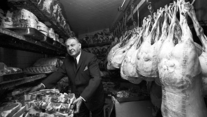 Carl Rosenfield takes a tray of chops from the meat locker at Carl's Chop House in 1966.  He established the restaurant in 1923, and for decades it was a favorite dining spot for Detroiters.  It closed in 2008.