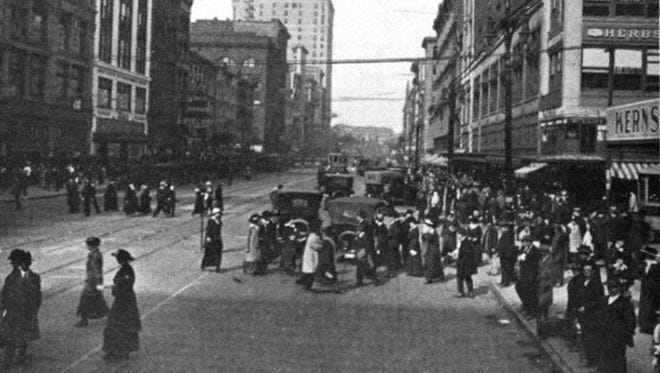 Pedestrians amble across Gratiot Avenue in this photo from "Story of the Detroit Police," James Couzens commissioner, 1917, published by the city of Detroit. Couzens campaigned to stop jaywalking to reduce accidents.