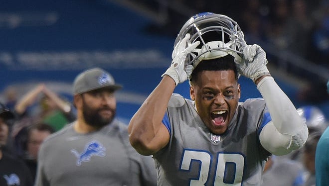 Lions' Jamal Agnew likes what he sees after teammate Quandre Diggs intercepts a pass in the end zone, intended for Bears' Dontrelle Inman in the fourth quarter.