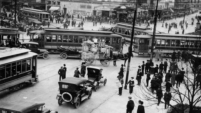 Campus Martius in downtown Detroit was a jumble of streetcars, automobiles, pedestrians and a horse-drawn wagon in 1917.