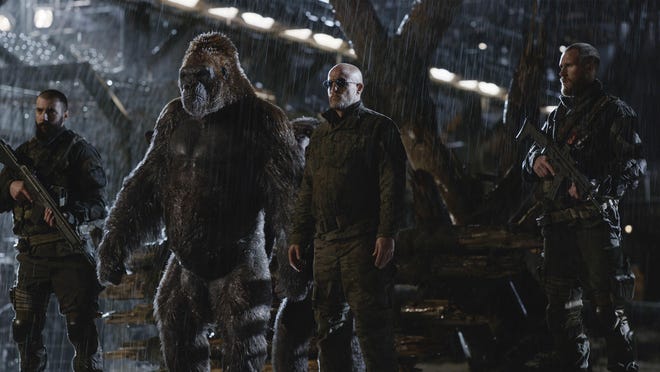 Woody Harrelson, center, in a scene from “War for the Planet of the Apes.”