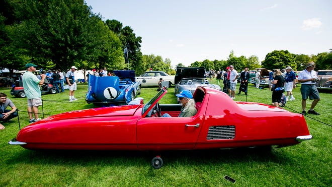 Jeff Lane of Nashiville, Tenn. sits in his 1967 Gyro-X, a Gyroscopically balanced car on display.