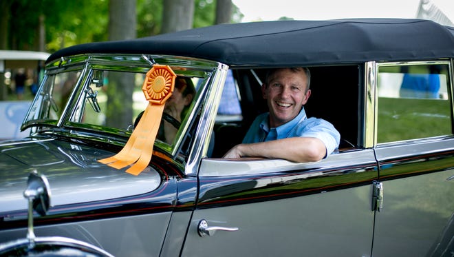 Bob Becker of Mount Forest, Ont. Canada sits in his 1932 Chrysler Imperial.