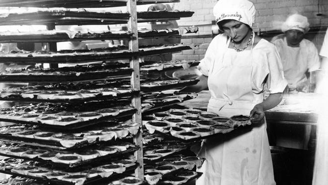 Another photo from the Ford Motor Co. restaurant in 1929 shows the kitchen staff preparing racks of some sort of pie.