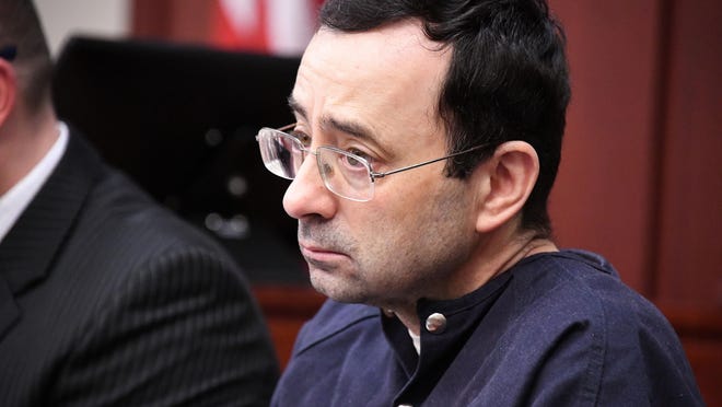 Larry Nassar listens to the testimony of Isabel Hutchins in the courtroom of Judge Rosemarie Aquilina on Tuesday.