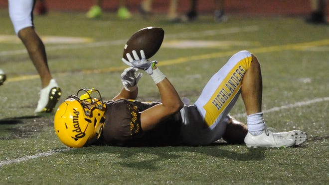 Rochester Adams running back Chase Kareta (6) lays on the ground after failing to get in the end zone on a 2-point conversion try against West Bloomfield  in the second half during a high school football game.