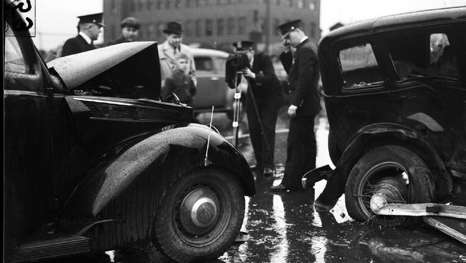Officers from the Accident Prevention Bureau photograph an accident in this undated photo. Inconsiderate drivers were called “fliverboobs” by the American Automobile Association.