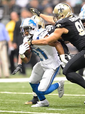 Defensive end Kasim Edebali, here closing in on Lions running back Ameer Abdullah,  grew up in Germany and is the son of an American serviceman.
