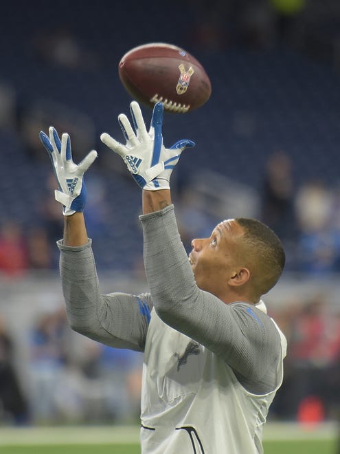 Lions wide receiver Kenny Golladay readies for an over-the shoulder reception during warmups.