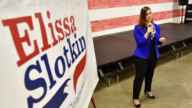 Democratic hopeful Elissa Slotkin talks with the media and supporters at an event in the Lansing Brewing Company on Monday, July 10, 2017 after she announced she would run for the seat currently held by U.S. Rep. Mike Bishop.