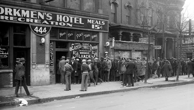 Men line up outside the Workmen's Hotel in Detroit for 5-cent Easter dinners in the 1920s. From the 1870s through the first half of the 20th century, shift workers often lived in lodging houses with no kitchen, depending on restaurants as their only source of cooked meals.