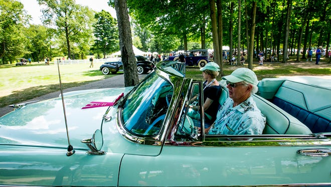 John and Lynne Cote of Guilford, Conn., sit n their 1956 Chrysler New Yorker.