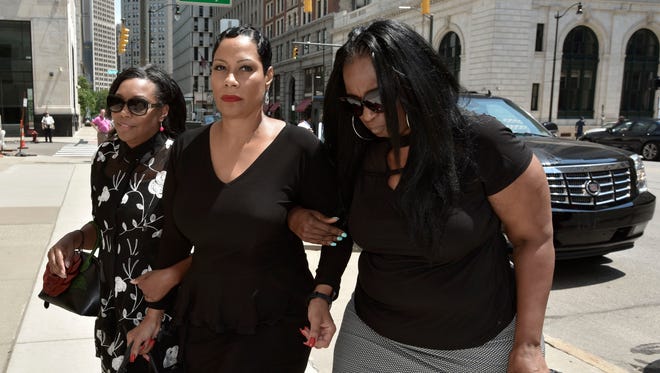 Monica Morgan-Holiefield, center, widow of the late UAW Vice President General Holiefield, was sentenced in July 2018 to 18 months in federal prison. She pleaded guilty to a federal tax crime.