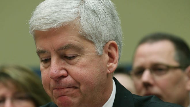 Gov. Rick Snyder, (R-MI), listens to members comments during a House Oversight and Government Reform Committee hearing, about the Flint, Michigan water crisis, on Capitol Hill March 17, 2016 in Washington, DC.