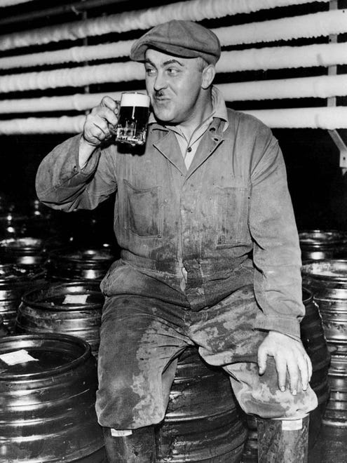 Theodore Gentile of Detroit celebrates the end of Prohibition with a cold beer in the cooler of the Tivoli Brewery in Detroit.