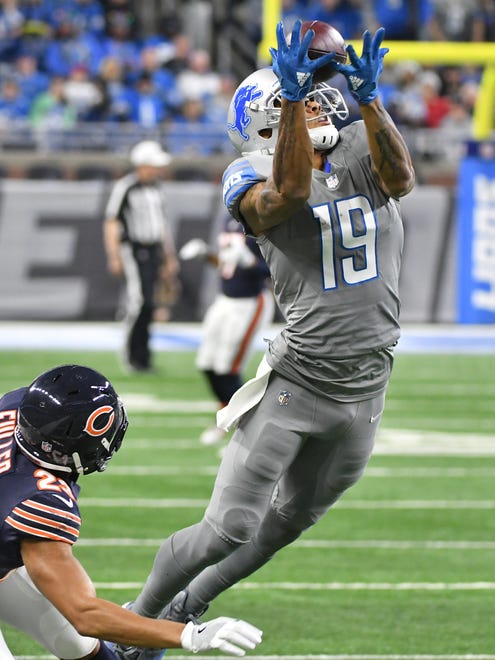Lions' Kenny Golladay pulls in an over-the-shoulder reception along the sidelines but is called for an interference call, knocking down Bears' Kyle Fuller before the reception in the second quarter.