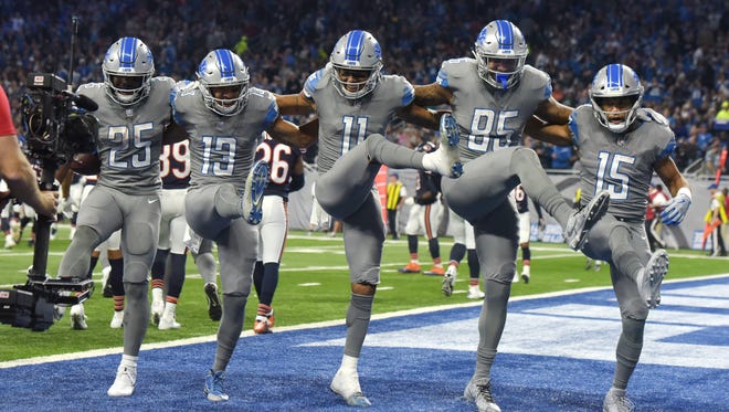 Lions' Theo Riddick, T.J. Jones, Marvin Jones Jr., Eric Ebron and Golden Tate celebrate Jones' touchdown with a 'Cancan' dance' in the second quarter of the 20-10 Detroit victory over the Chicago Bears at Ford Field in Detroit, Michigan on December 16, 2017.