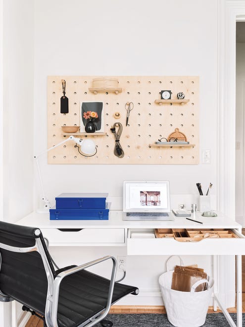 Carlson and Guralnick suggest a wall-mounted pegboard and IKEA desk for a simple but orderly work station or home office. The pegboard is from Kreisdesign.