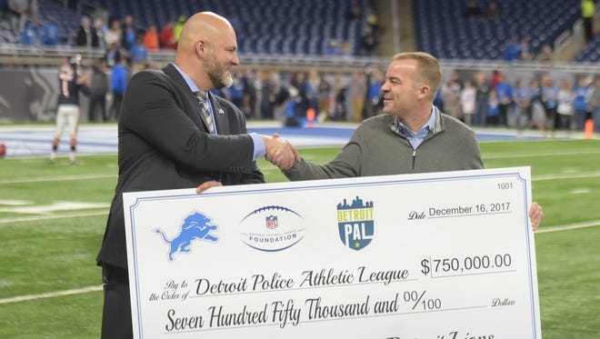 Detroit Lions Vice President of Corporate Partnerships, Bill Hawker presents Detroit PAL CEO Tim Richey a ceremonial check for $750,000 grant to be used for the construction of the new headquarters and athletic facilities at ‘The Corner Ballpark on the former site of Tiger Stadium.