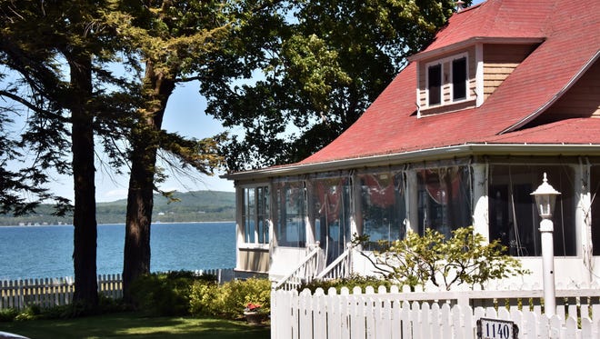 A Bay Vie cottage overlooks Little Traverse Bay Thursday, June 14, 2018  in the enclave of Bay View near Petoskey, Michigan. The 143-year-old Methodist assembly camp features 440 cottages, two hotels, a post office, beach and swim area and a sail house.