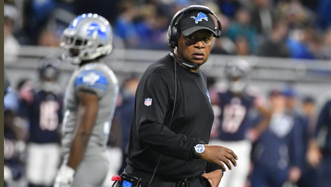 Lions head coach Jim Caldwell on the field after an injury during the fourth quarter.