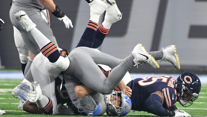 Lions quarterback Matthew Stafford is sacked by Bears' roy Robertson-Harris in the first quarter.