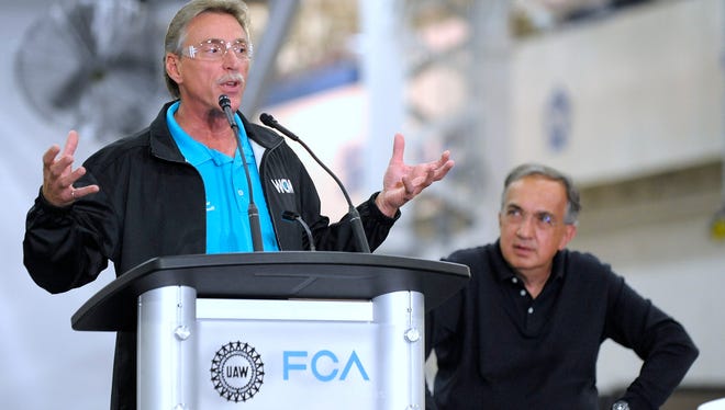 Norwood Jewell, UAW V.P. of the FCA US Department, speaks at the Sterling Stamping Plant in 2016 as FCA CEO Sergio Marchionne listens.
