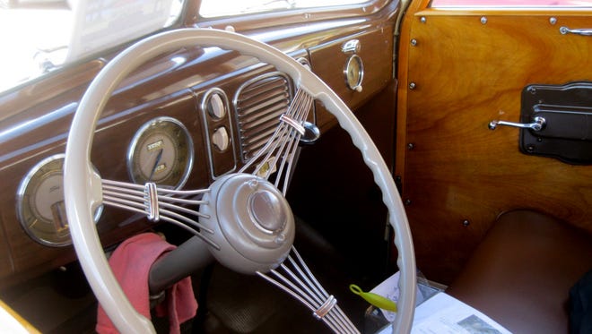 The interior of the Olsons’ ’38 Ford includes art deco lines on the dashboard and steering wheel spokes.