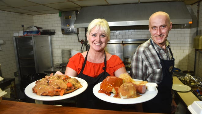 Cook Marzena Kwiatkowscy (right) and her husband Pavel, Polish Village Cafe, prepared  a Polish Plate (left) know as "a taste of Poland" and the Hungarian Pancake.