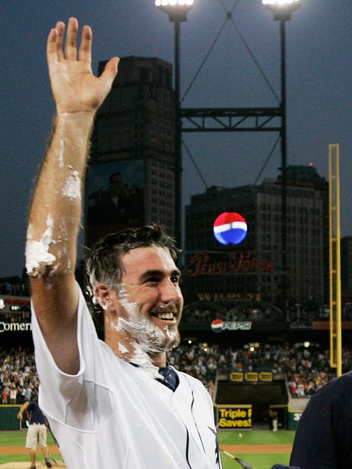Covered in something like whip cream Justin Verlander waves to the Comerica Park crowd after pitching a no-hitter against the Milwaukee Brewers on June 12, 2007.
