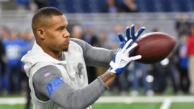 Lions wide receiver Kenny Golladay readies his hands for a reception during warmups before Detroit Lions takes on the Chicago Bears.