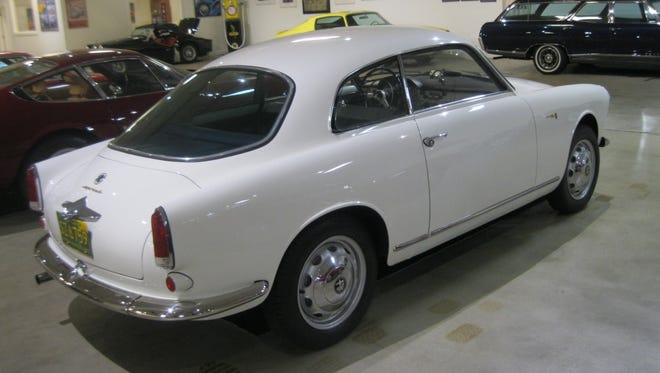 A handsome 1960 Alfa Romeo Giuilietta Sprint is powered by a 1300-cc engine with dual overhead cam and two carburetors.