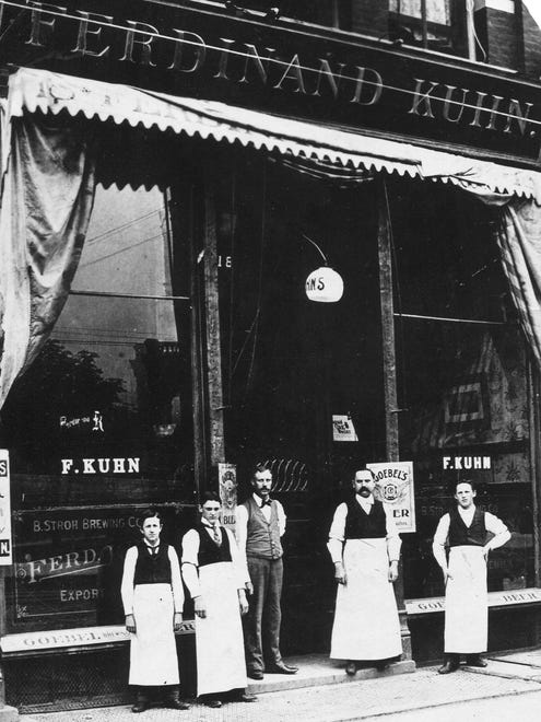 Employees pose outside the Ferdinand Kuhn Saloon in Detroit in this undated photo. By 1915, Detroit had 1,700 saloons, roughly one for every 50 families.