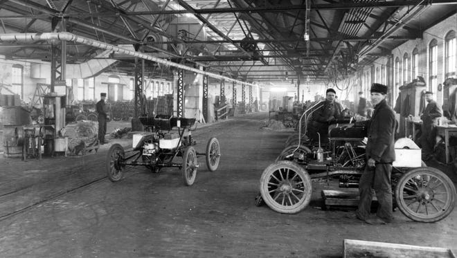 Oldsmobiles are built at the Olds Motor Works plant in Detroit, circa 1904-06.  As Detroit became the hub of automobile production,  the number of cars on city streets eclipsed that of other cities, where cars were bought primarily by the wealthy.