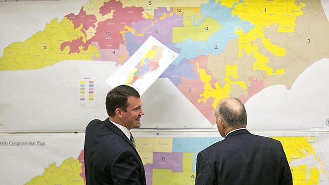 North Carolina elected officials review historical district maps in 2016.