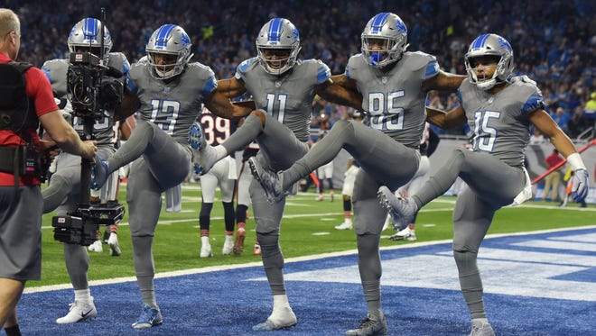 From left, the Lions' Theo Riddick, T.J. Jones, Marvin Jones Jr., Eric Ebron and Golden Tate celebrate Jones' touchdown with a can-can dance in the second quarter.