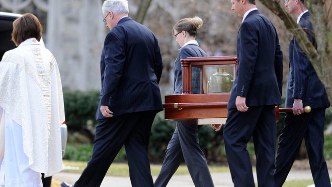 Pallbearers carry Jane Bashara's remains from the church. Later her aunt said any family sympathy for Robert Bashara vanished after he tried to use his dead wife’s ashes as a bargaining chip, saying he would return them to her relatives if they would publicly support him after his arrest.