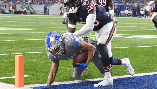 Lions' Marvin Jones Jr. takes the reception into the end zone for a touchdown past Bears' Eddie Jackson in the second quarter.